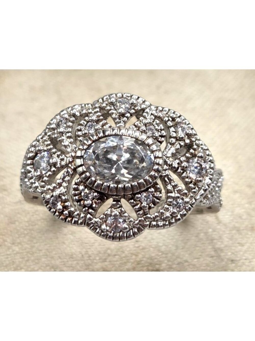 Vintage-Style Oval Cubic Zirconia Silver Ring With Intricate Detailing
